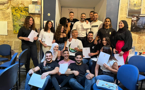 Young people gathered with papers