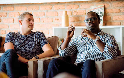 Two people talking and thinking